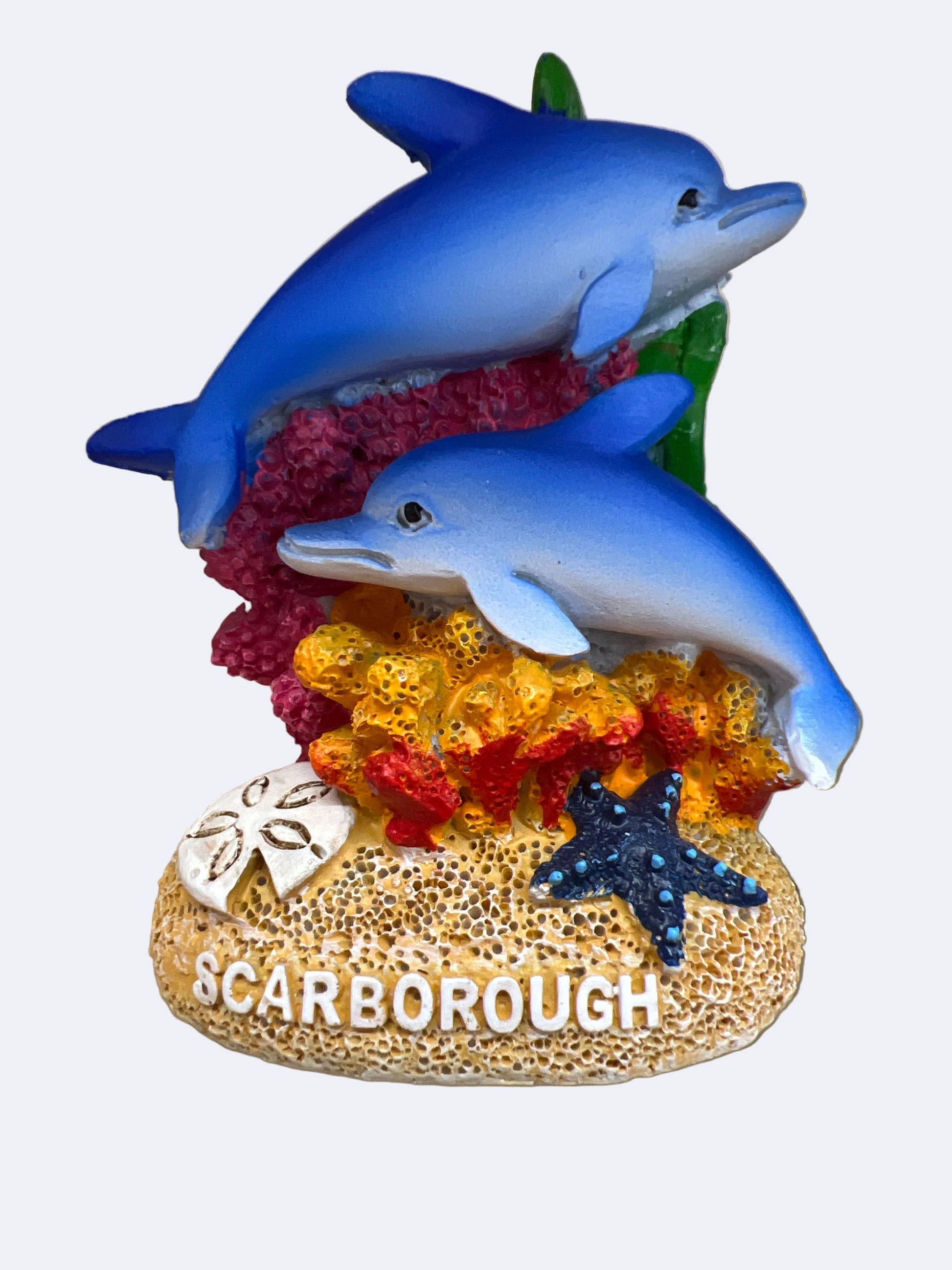 Decorative item with two dolphins on coral, featuring the word 'Scarborough'.