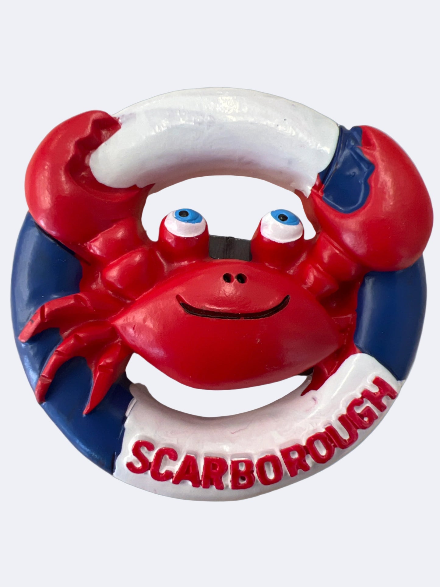 A round magnet in the shape of a life ring with a red and blue crab design and the word 'SCARBOROUGH' displayed.