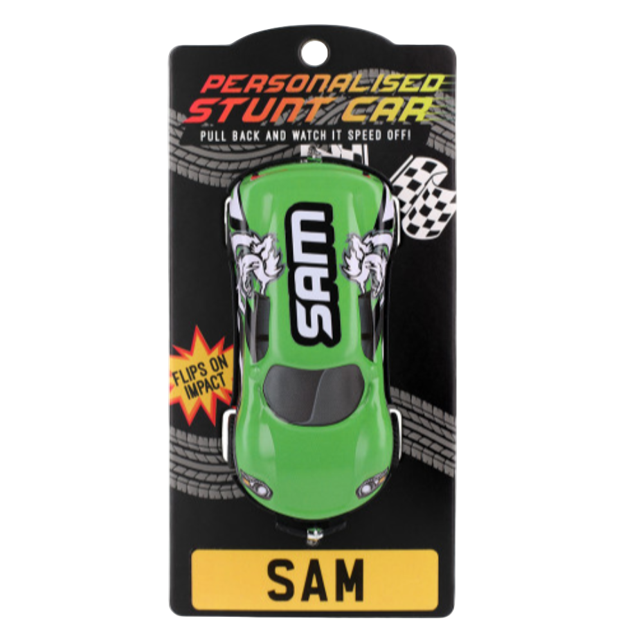 A personalized stunt toy car named 'SAM' in orange color, packaged on a black backing card with the name displayed prominently at the bottom.