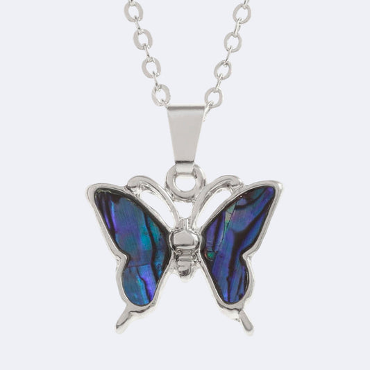A purple butterfly necklace with a Paua shell pendant on a silver trace chain.