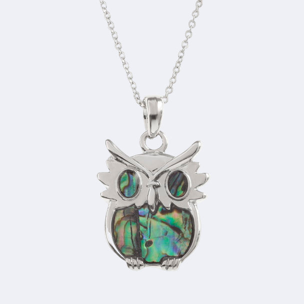 A silver owl necklace with a natural paua shell pendant on a trace chain, presented in a Tide Jewellery box.