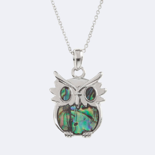 A silver owl necklace with a natural paua shell pendant on a trace chain, presented in a Tide Jewellery box.