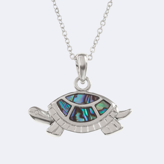A silver-colored tortoise necklace with a natural paua shell pendant on a trace chain, presented against a white background.