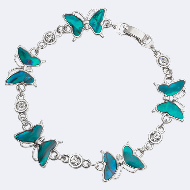 A bracelet featuring blue paua shell butterflies with glass crystal spacers on a silver-tone chain.