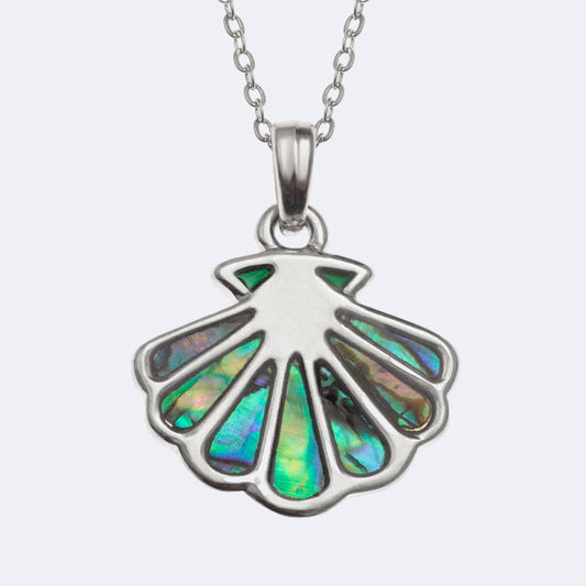 A silver-colored scallop shell necklace with a paua shell pendant, displayed on a chain.