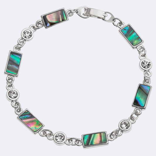 A bracelet with rectangle sections featuring natural Paua shell and inset glass stones, with rhodium plating.