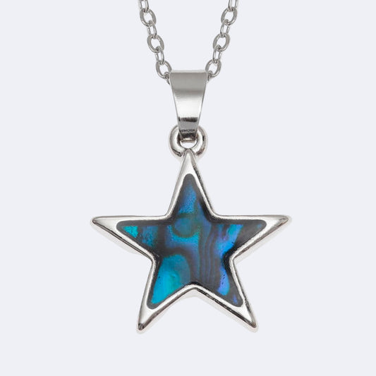 A silver-colored star-shaped necklace with a blue paua shell pendant, displayed on a chain.