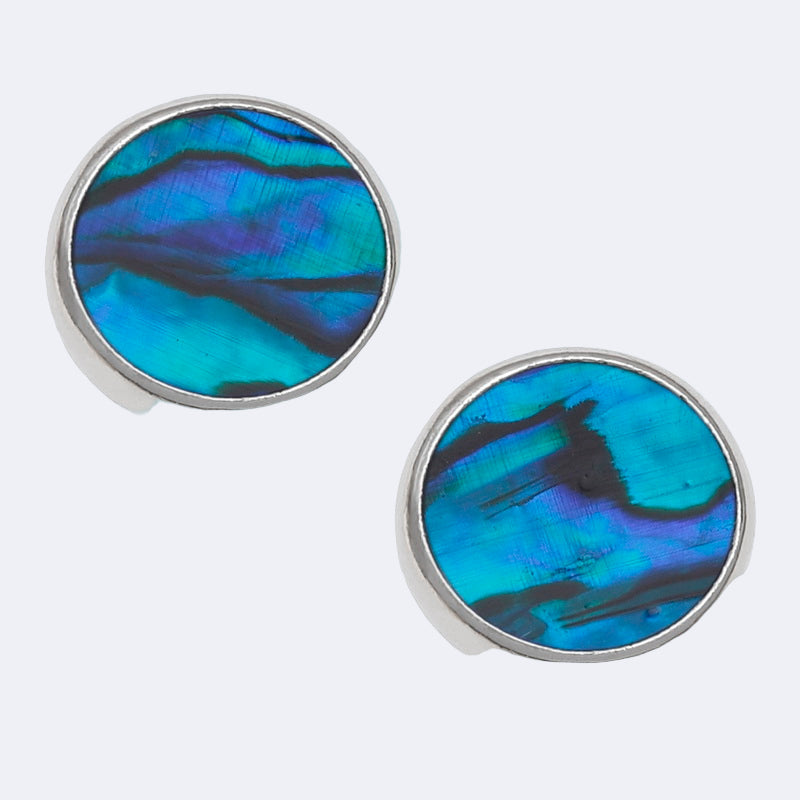 A pair of round stud earrings with blue paua shell design, presented against a white background.