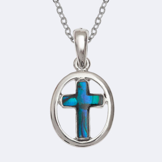 A blue oval cross necklace with a Paua shell pendant on a silver chain, presented in a box.