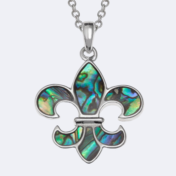 A silver-colored Fleur de lys necklace with a natural Paua shell pendant on a trace chain, presented in a Tide Jewellery box.