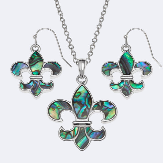 A silver-colored necklace with a fleur-de-lis design and a matching pair of earrings, both featuring a central Paua bead surrounded by silver metal.
