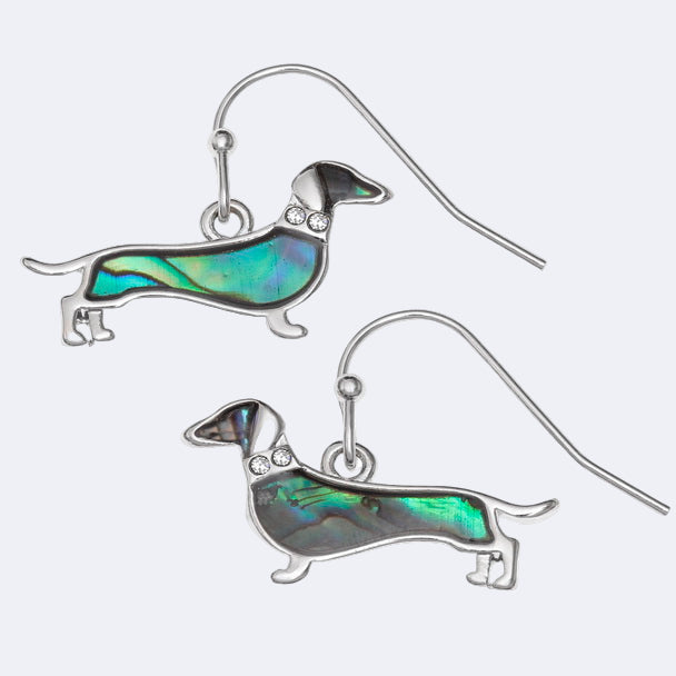 A pair of dachshund dog hook earrings with natural paua shell and inset glass stones representing a collar, rhodium plated.