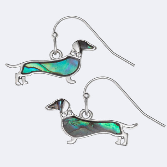 A pair of dachshund dog hook earrings with natural paua shell and inset glass stones representing a collar, rhodium plated.