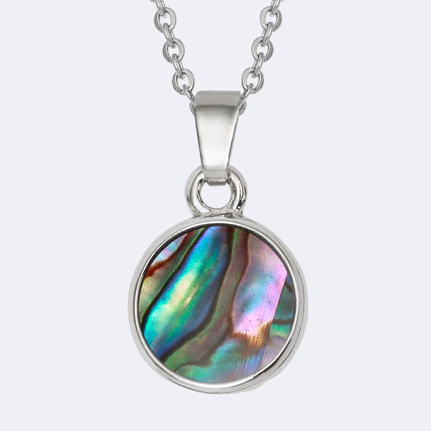 A round necklace with a natural Paua shell pendant on a trace chain, presented in a Tide Jewellery box.