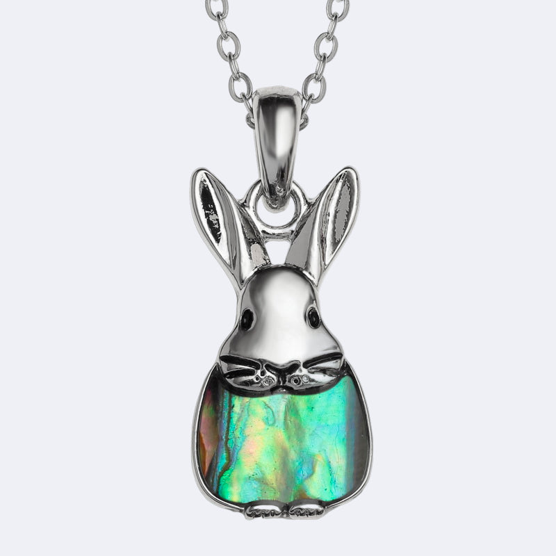 Silver rabbit-shaped pendant with a colorful stone on a white background