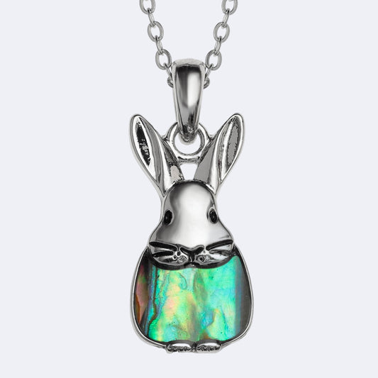 Silver rabbit-shaped pendant with a colorful stone on a white background