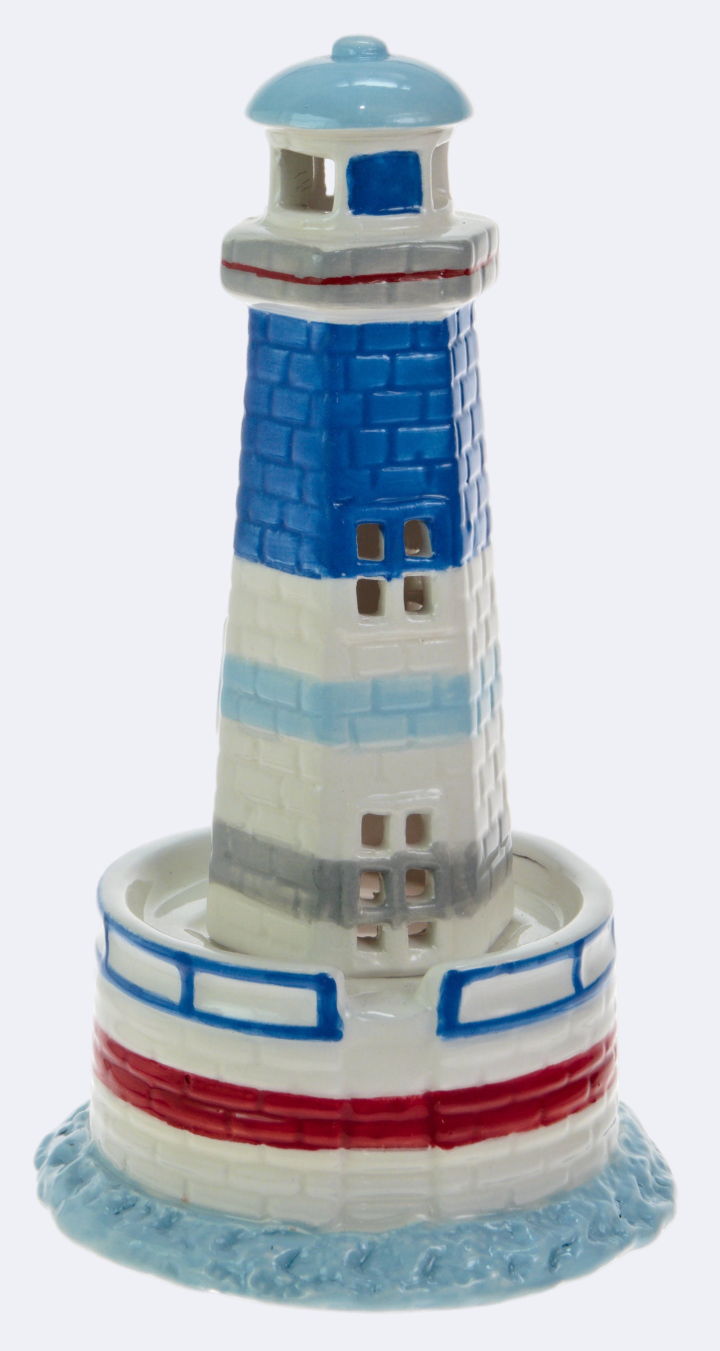 A small decorative LED lighthouse with blue, white, and red colors.