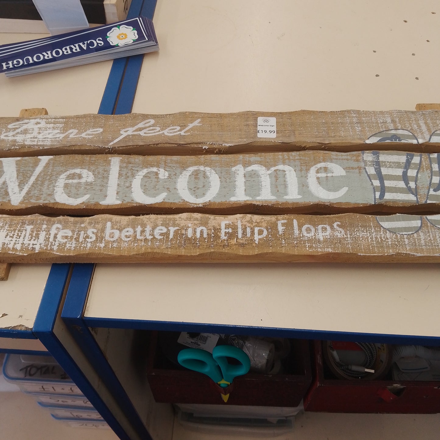 Welcome in flip flops sign