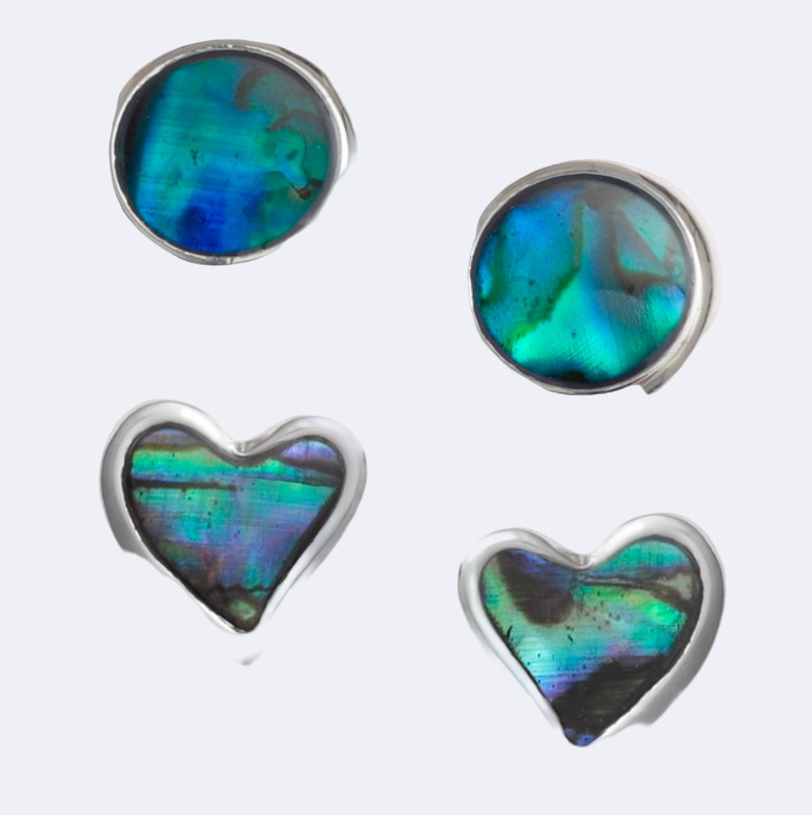 A set of stud earrings featuring one pair with a round blue Paua shell and another pair with a heart-shaped Paua shell, all mounted on a white background.