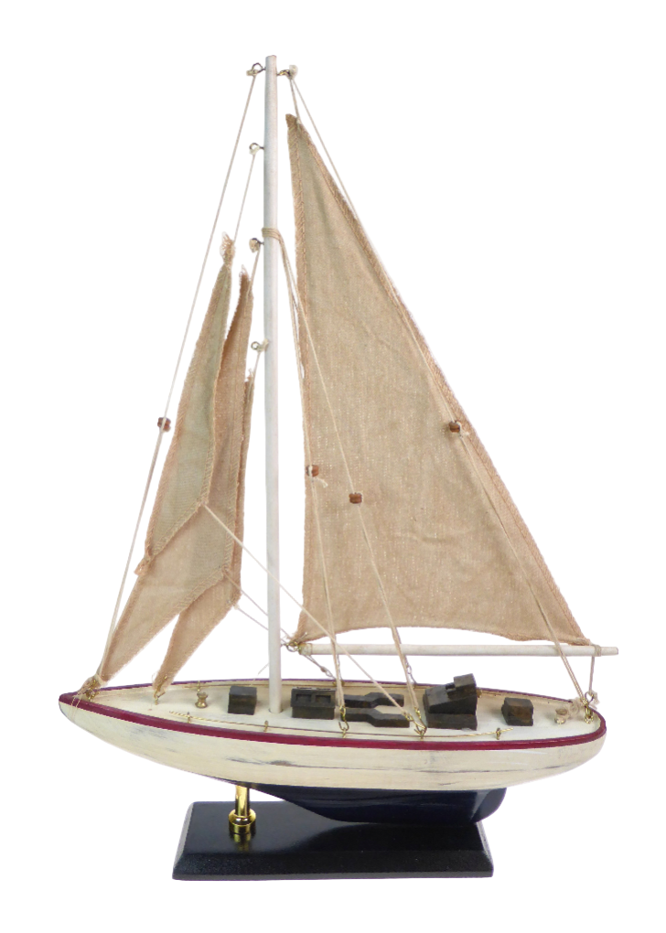 Model sailboat with beige sails on a white background