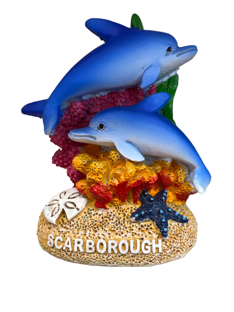 Decorative item with two blue dolphins on a coral reef, featuring the word 'Scarborough'.