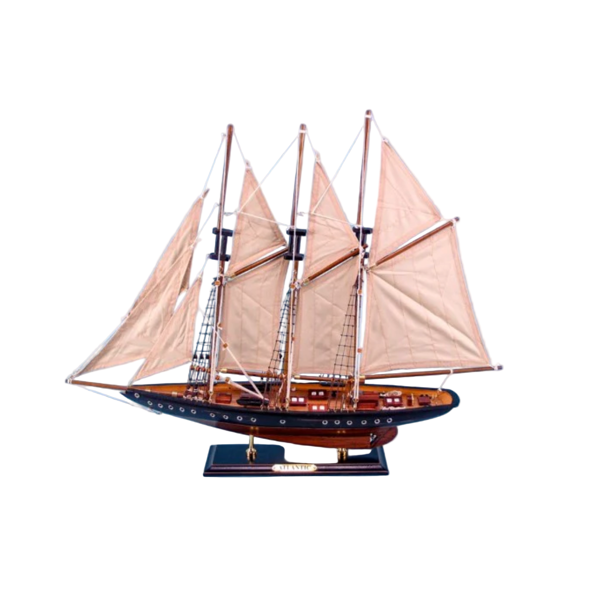Model sailboat with three masts and white sails against a blue background