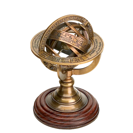 Brass astrolabe on a wooden base against a white background