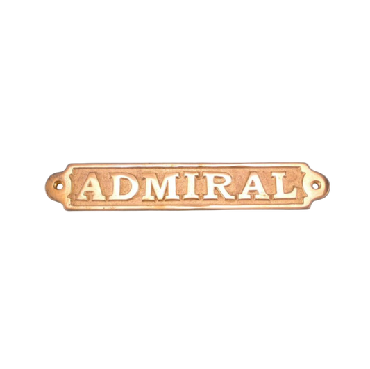 Brass plaque with 'ADMIRAL' text on a blue background