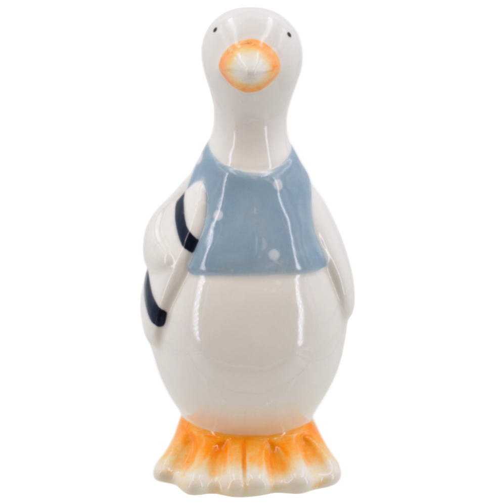 Ceramic seagull figurine with a blue vest and holding a surfboard on a white background