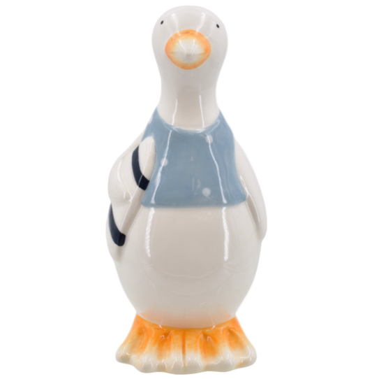 Ceramic seagull figurine with a blue vest and holding a surfboard on a white background