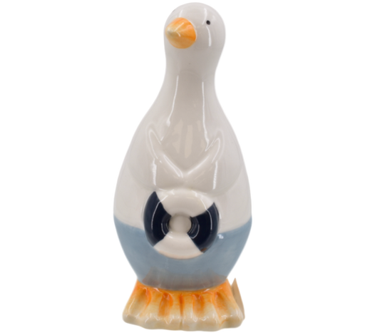 Decorative seagull-shaped ornament with a white body, orange beak, and feet holding a blue and white lifering