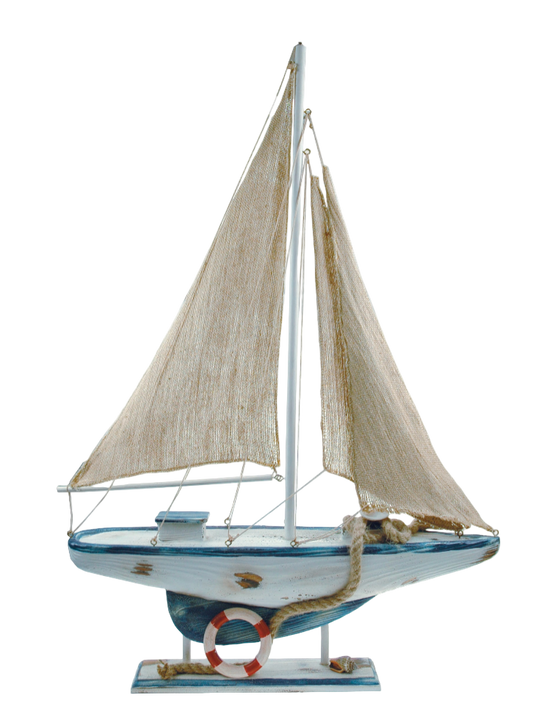 Model sailboat with white sails and blue hull on a white background