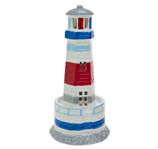 Decorative lighthouse model with red, white, and blue colors on a white background