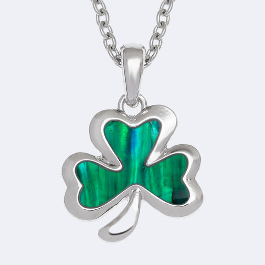 Silver necklace with a green shamrock pendant on a white background