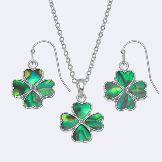 Four-leaf clover jewelry set with necklace and earrings on a white background
