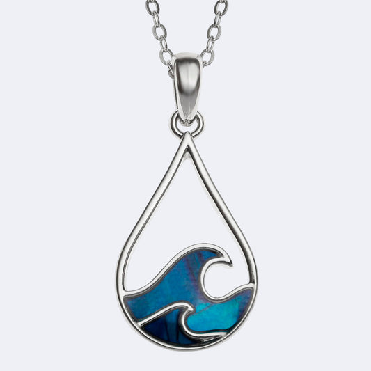 Silver necklace with a blue wave pendant on a white background