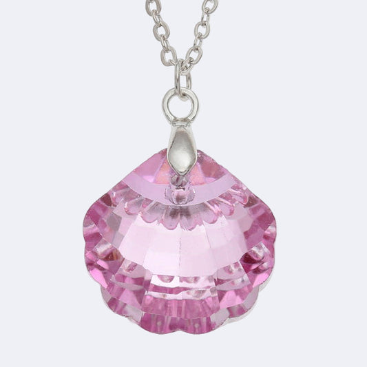Pink crystal pendant on a silver chain against a white background