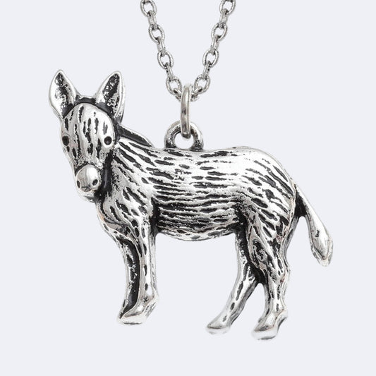 Silver donkey pendant on a chain against a white background
